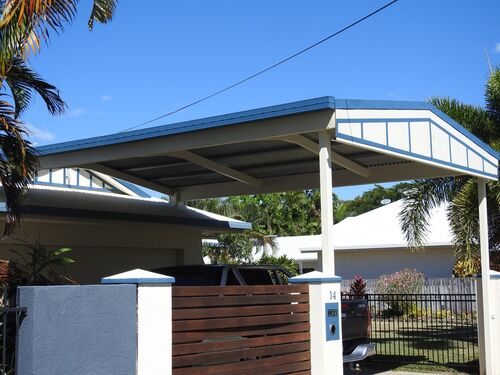 Blue and white hard roof over driveway