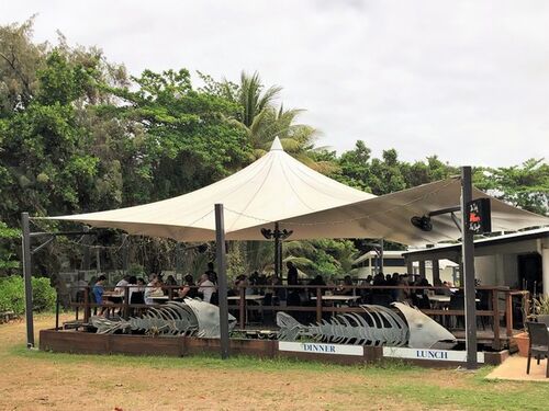 Conical shade sail over restaurant